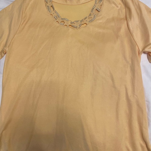 Yellow loose blouse with neckline design used