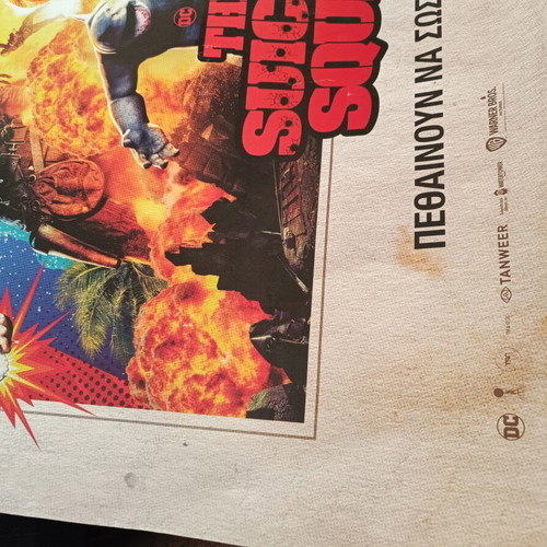 The Suicide Squad movie poster used with visible wear