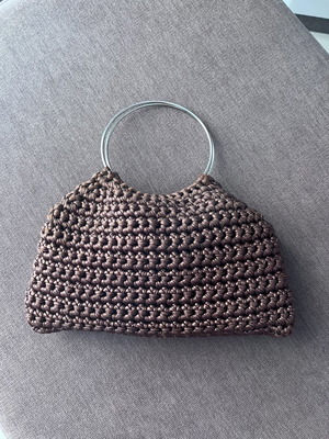 Brown metallic knitted handbag with silver ring handles
