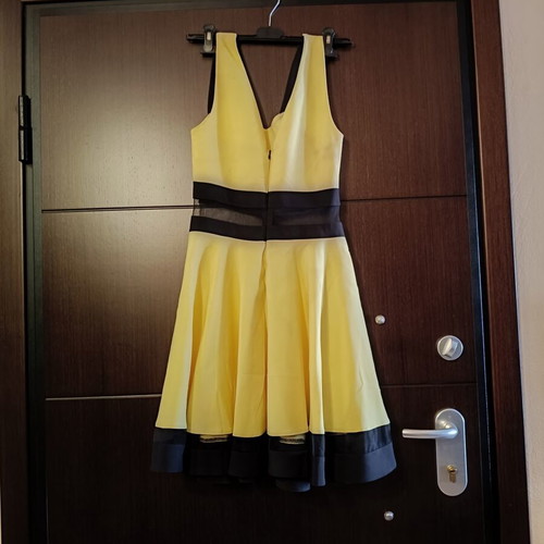 Cocktail dress with transparency at the waist like new, size M