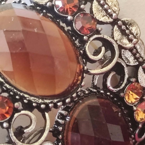 Vintage cuff bracelet with large brown stones and decorative details
