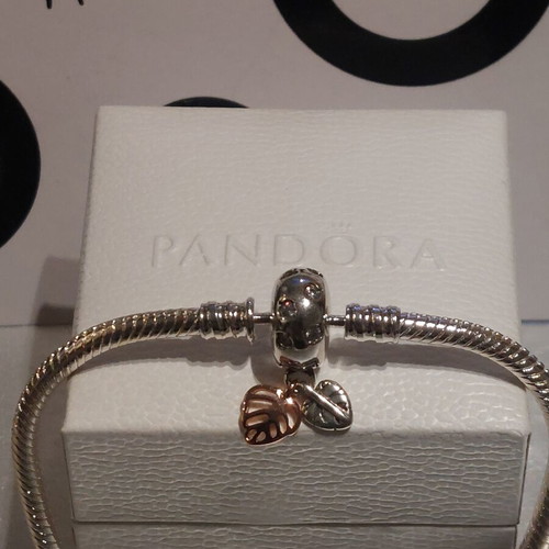 Pandora bracelet size 18 with round clasp and two leaf charms