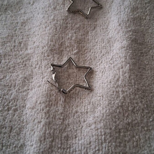 Star-shaped earrings lightly worn