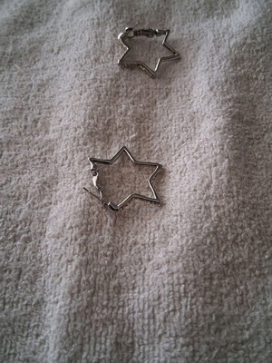 Star-shaped earrings lightly worn
