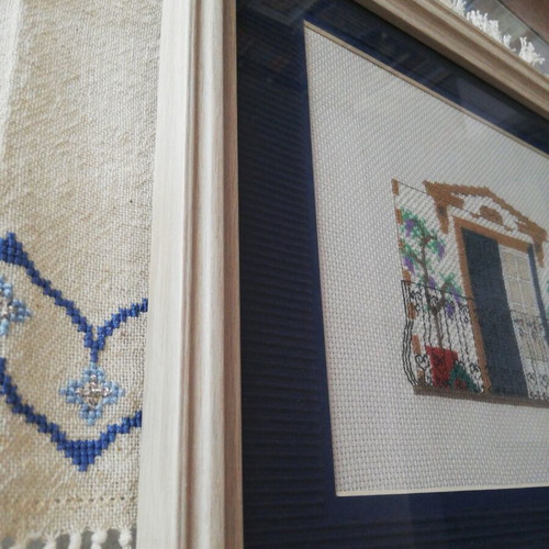 Embroidered textile painting with wooden frame
