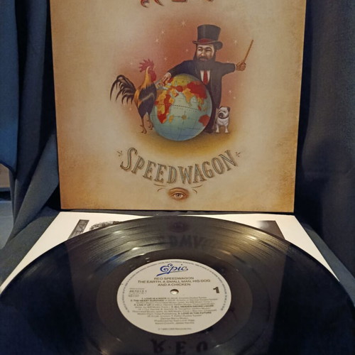 The Earth, a Small Man, His Dog and a Chicken vinyl LP used by REO Speedwagon