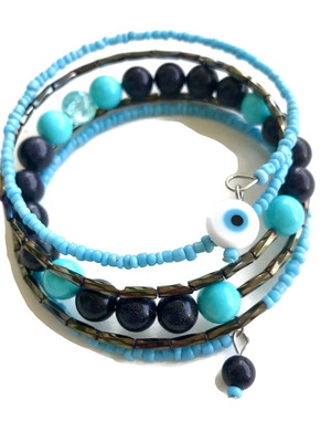 Blue bracelet with five rows of beads and a ceramic eye on memory wire