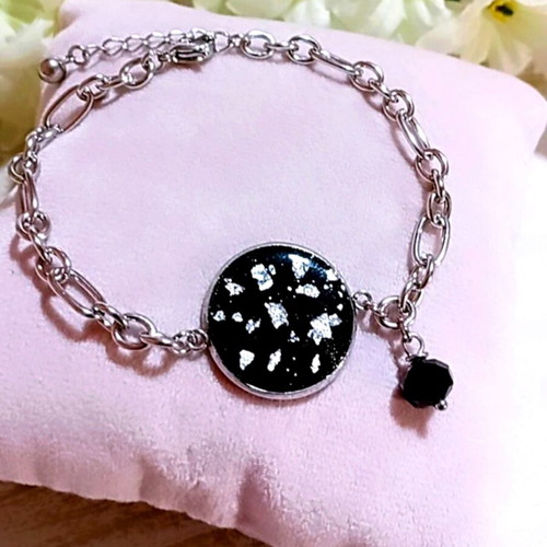 Handmade steel bracelet with iridescent black motif and silver flakes