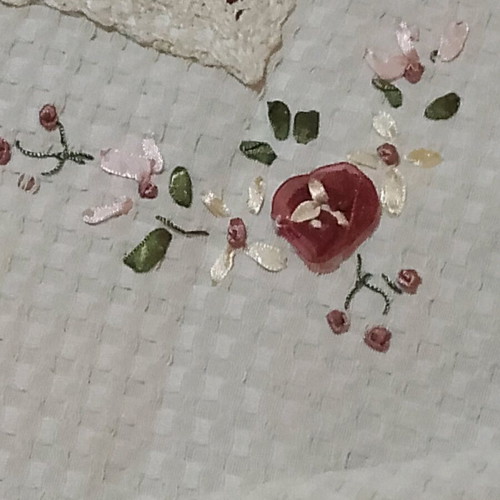 Embroidered tablecloth like new with satin ribbon and floral motifs