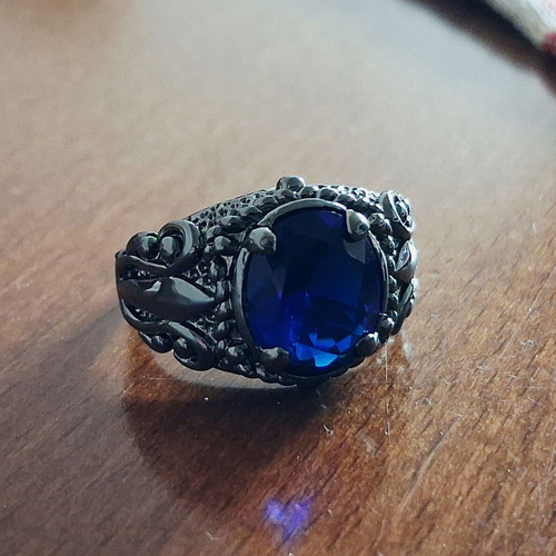 Ring with blue sapphire new, black rhodium plating