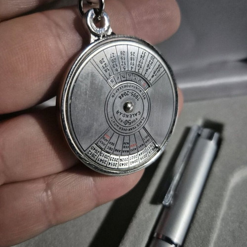 Vintage metal 50-year calendar keychain and metal pen like new