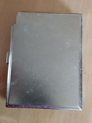 Metal cigarette case used with lighter holder