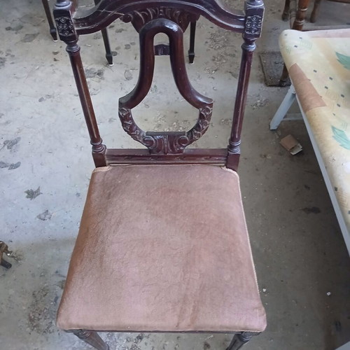 Vintage wooden chair used with brown velvet upholstery