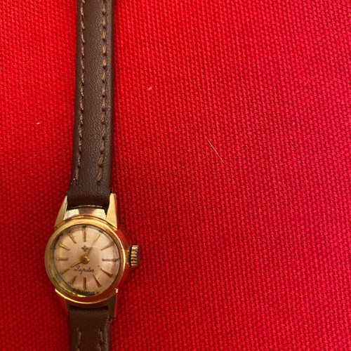 Wristwatch women's used, wind-up, metal, gold color, 1960s era
