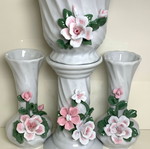Porcelain set of two jars and flowerpot used with floral decoration