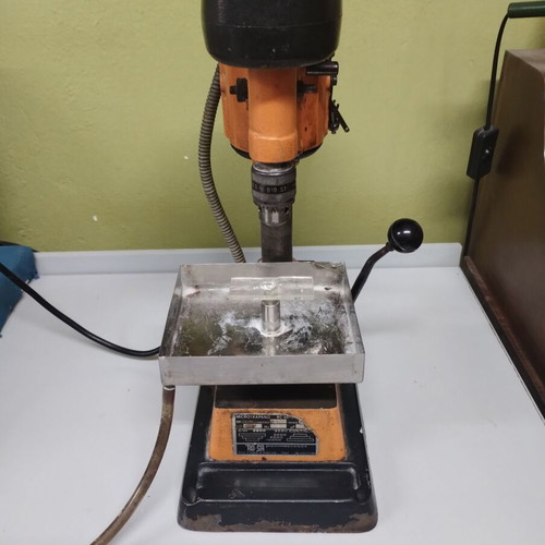 Bench drill press used with water supply for stone drilling