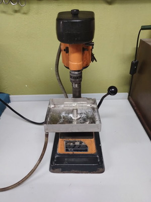 Bench drill press used with water supply for stone drilling