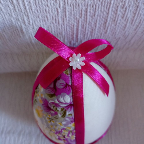 Decorative egg used in floral purple and fuchsia