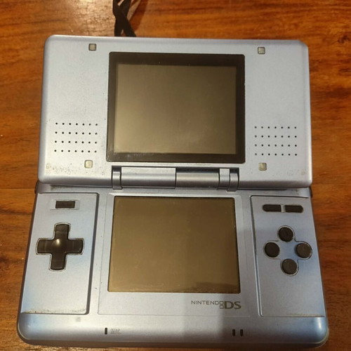 Nintendo DS console with charger and stylus
