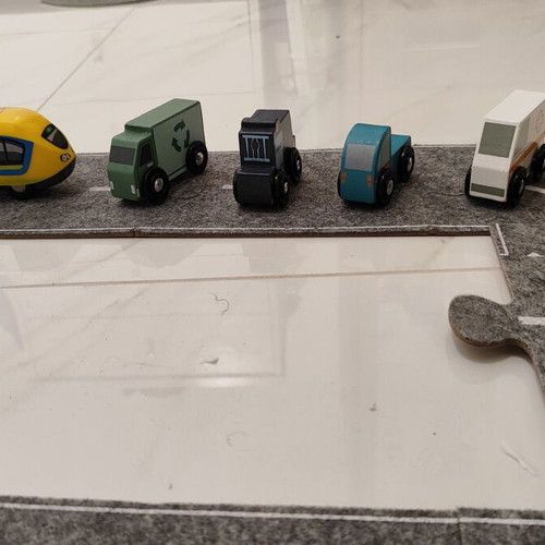 Racetrack with wooden vehicle figures like new