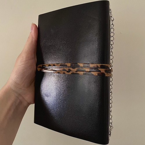Handmade leather journal with customizable inserts and charm