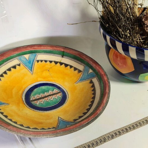 Mexican style ceramic plate and vase with plant composition used