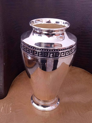 Silver-plated decorative vase with embossed meander design like new
