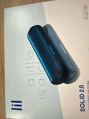 Iqos Lil Solid used with charger and cleaning brush