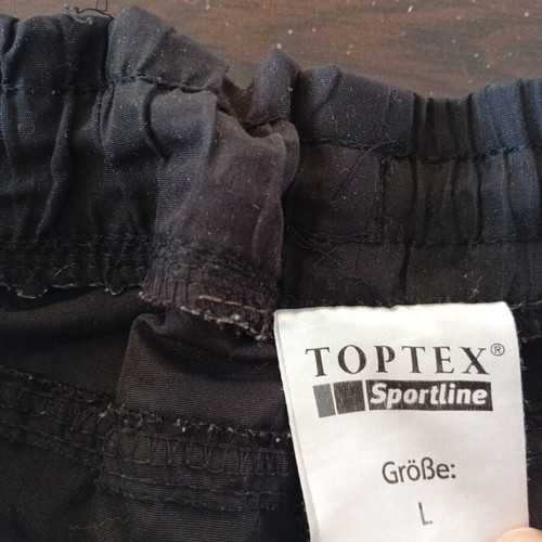 Top Tex men's swim shorts used, size Large, black and green