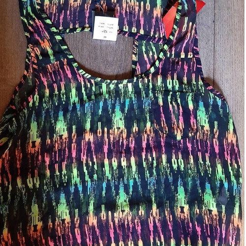 Blouse new with design on back, size M