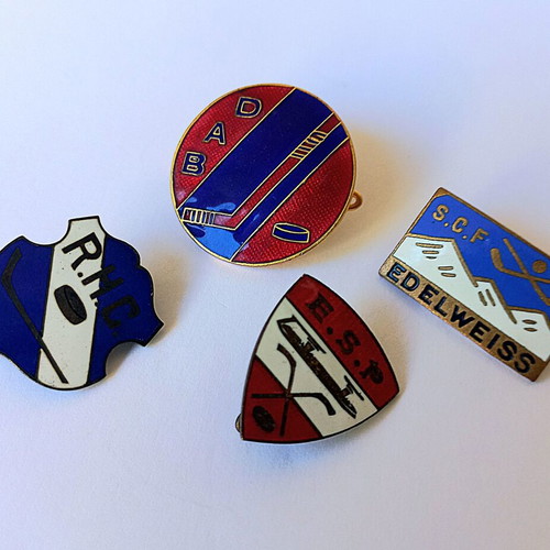 Set of vintage sports enamel pins with hockey theme, used