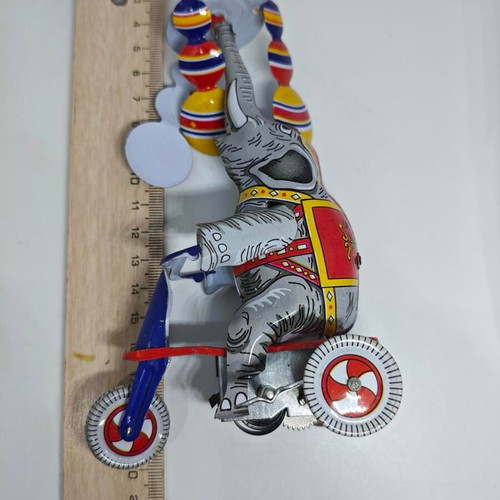 Vintage metal elephant on tricycle like new