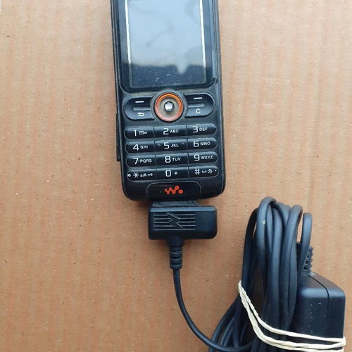 Sony Ericsson phone with charger used