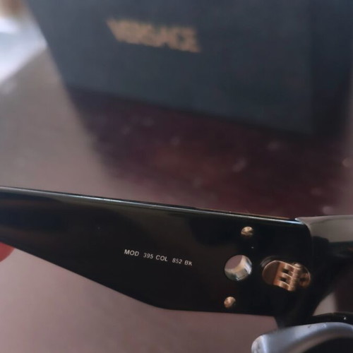 Versace collectible sunglasses, black lenses and frame