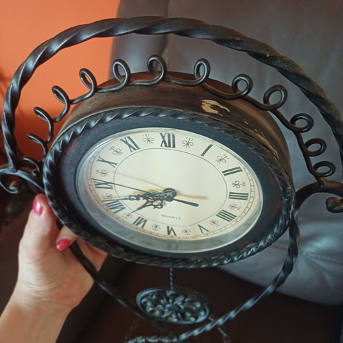 Vintage table clock with pendulum from wrought iron decorative