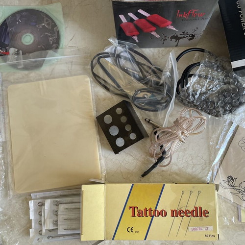 Dragonhawk Tattoo Coil Set used with extra practice materials