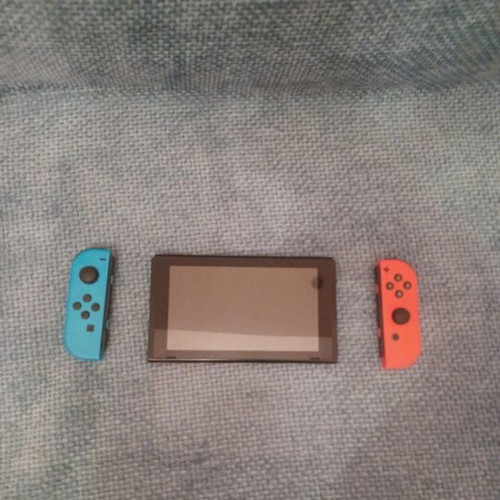 Nintendo Switch console with controller, Mario Kart Deluxe 8 code