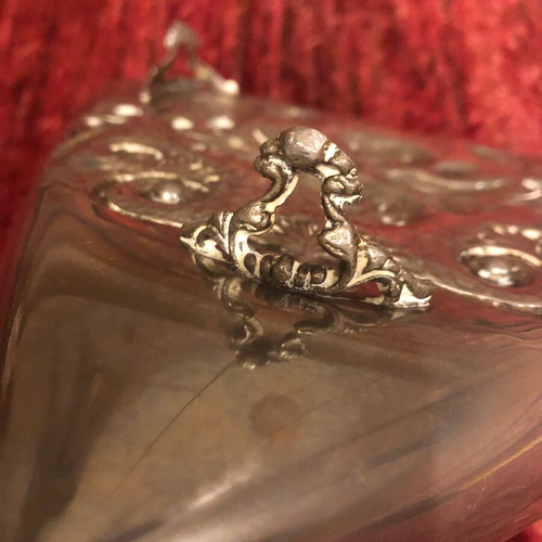 Decorative triangular vessel used with embossed flowers