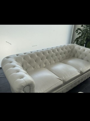 Leather three-seater sofa