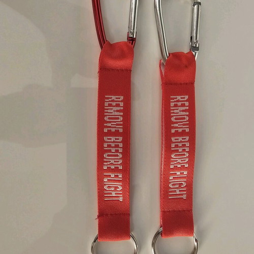 Remove Before Flight keychain new, set of 5 red pieces