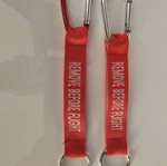 Remove Before Flight keychain new, set of 5 red pieces