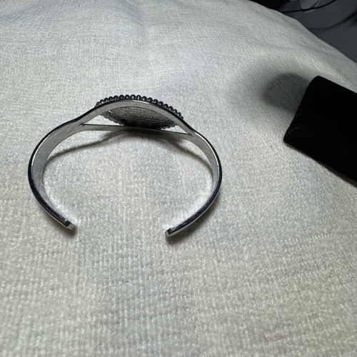 Adjustable bracelet like new, orange and silver