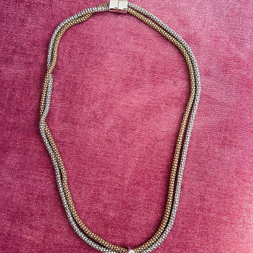 Necklace used in gold and silver color with decorative detail