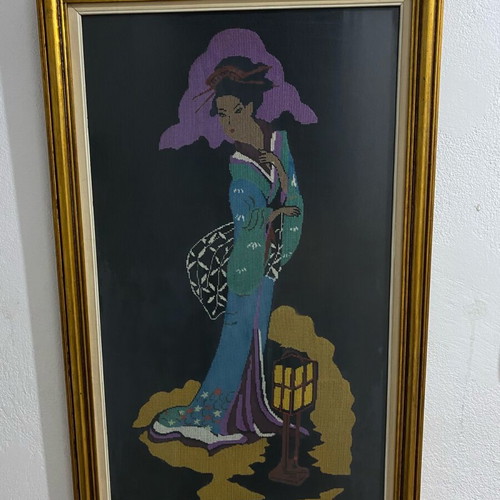 Textile painting with embroidered design used