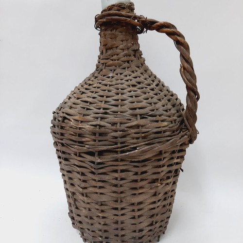 Dame-Jeanne vintage demijohn bottle used, glass with wicker