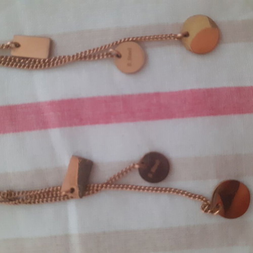 Triple hanging earrings made of steel in gold color like new