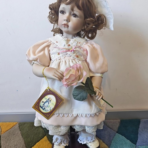 Alberon Casey porcelain doll with wooden stand, 50cm