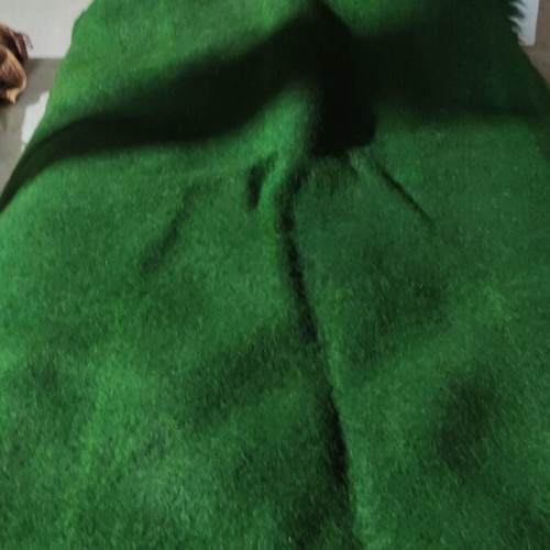 Wool flokati rug like new, dark green with discoloration