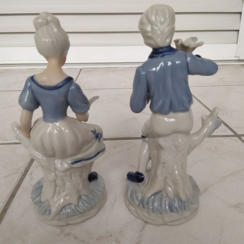 Vintage decorative figurines of boy and girl like new, 19 cm tall