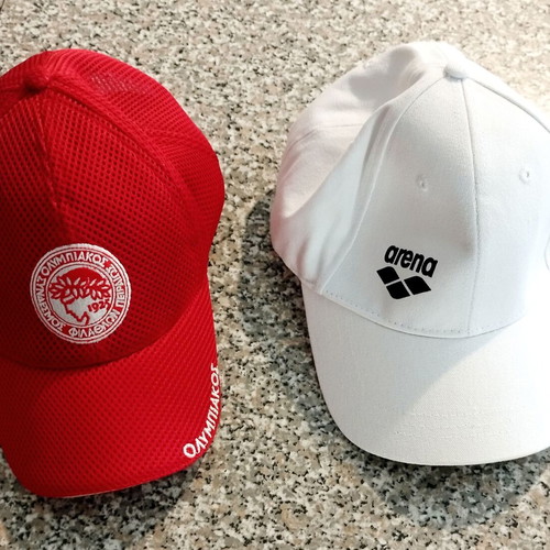 Arena white cap and Olympiakos red cap set
